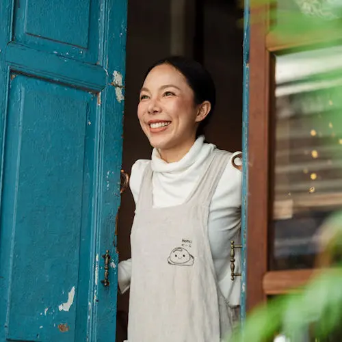 Woman smiling in doorway